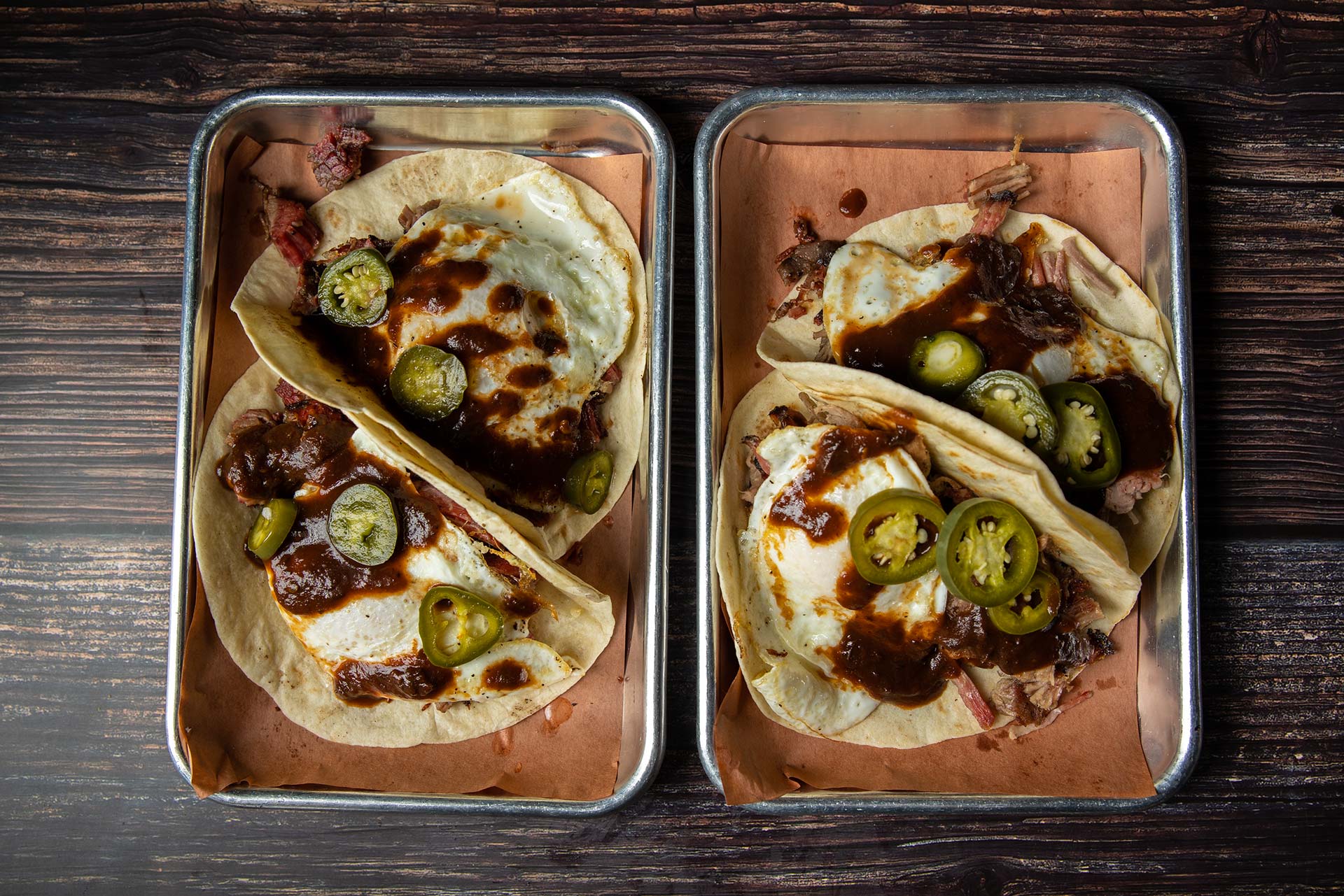 plated pulled pork and brisket tacos